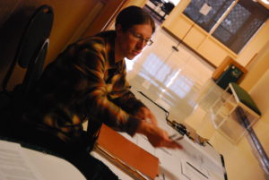 FRSES volunteer hands out judging sheets