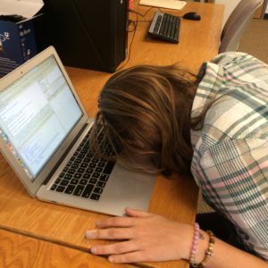 Student sleeping on computer