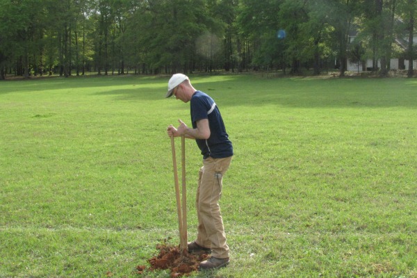 Dr. Stephen Ogle digging for soil samples