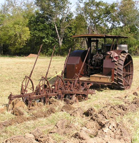 Old tractor and tilling system.