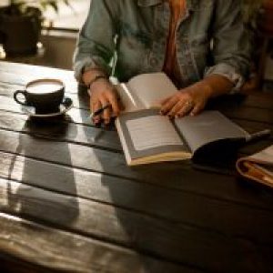 Image of women reading at a table
